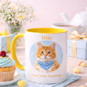 Personalised yellow handle kitten mug featuring an orange and white kitten with a blue bow tie and the name Santi