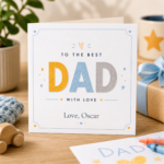 Personalised Dad card featuring soft blue and yellow lettering, the message To The Best Dad With Love, and the custom name Oscar