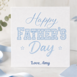 Personalised Happy Fathers Day card featuring soft blue typography, subtle star details, and the custom sign off Love, Amy