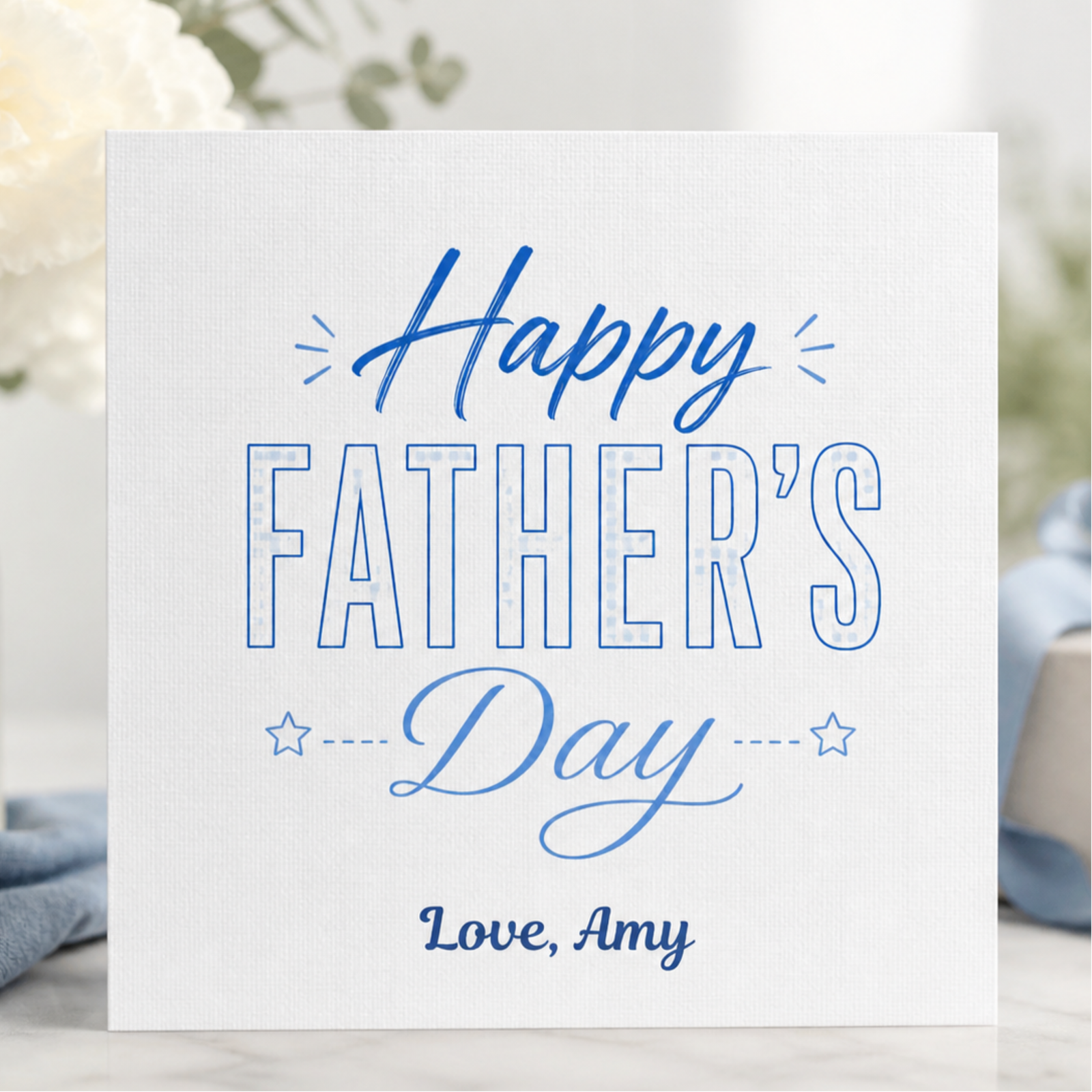 Personalised Happy Fathers Day card featuring elegant blue typography, subtle star details, and the custom sign off Love, Amy