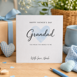 Personalised Father’s Day card for Grandad featuring elegant script lettering, a soft blue heart design, and the custom sign off With love, Noah