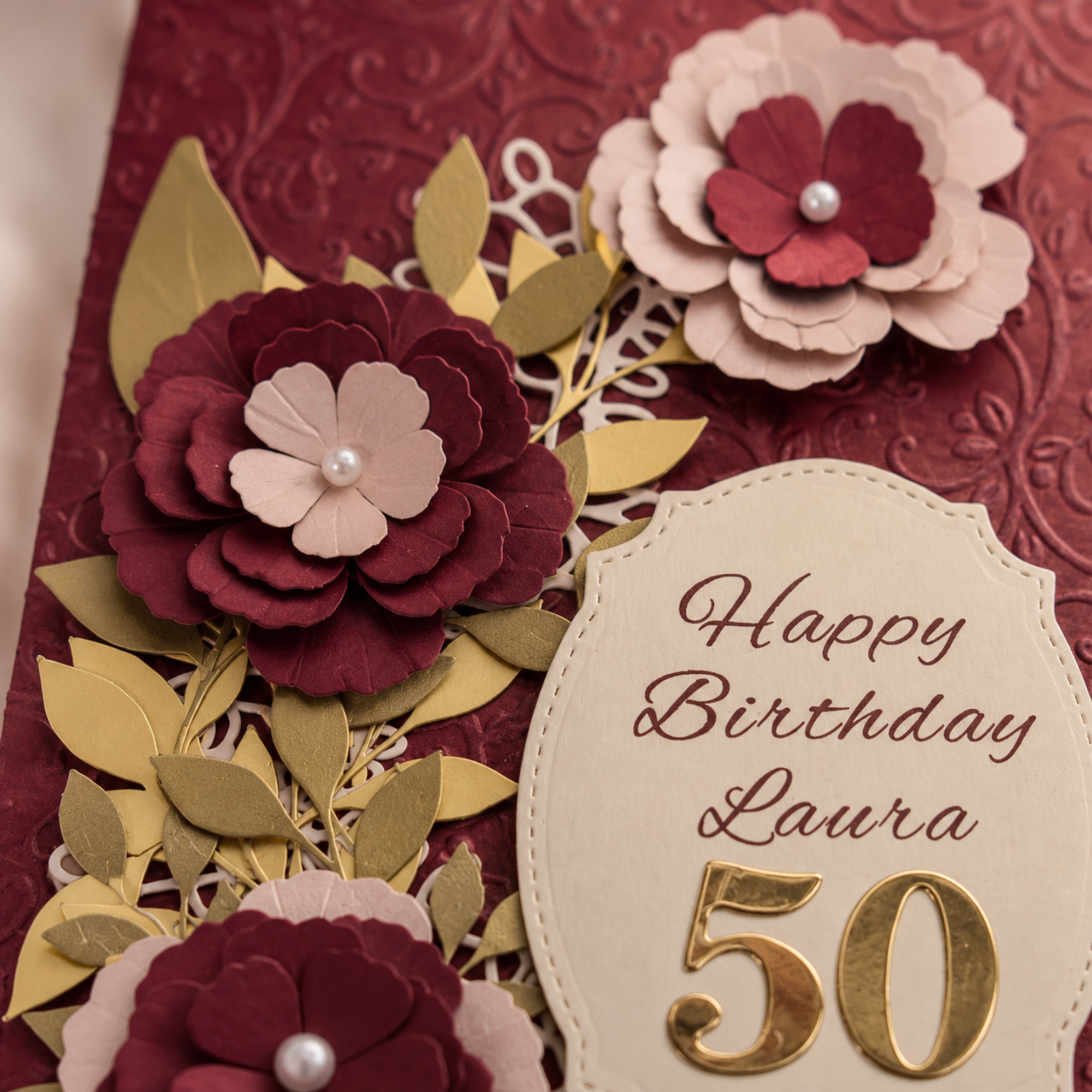 Personalised burgundy milestone birthday card showing custom name and age details